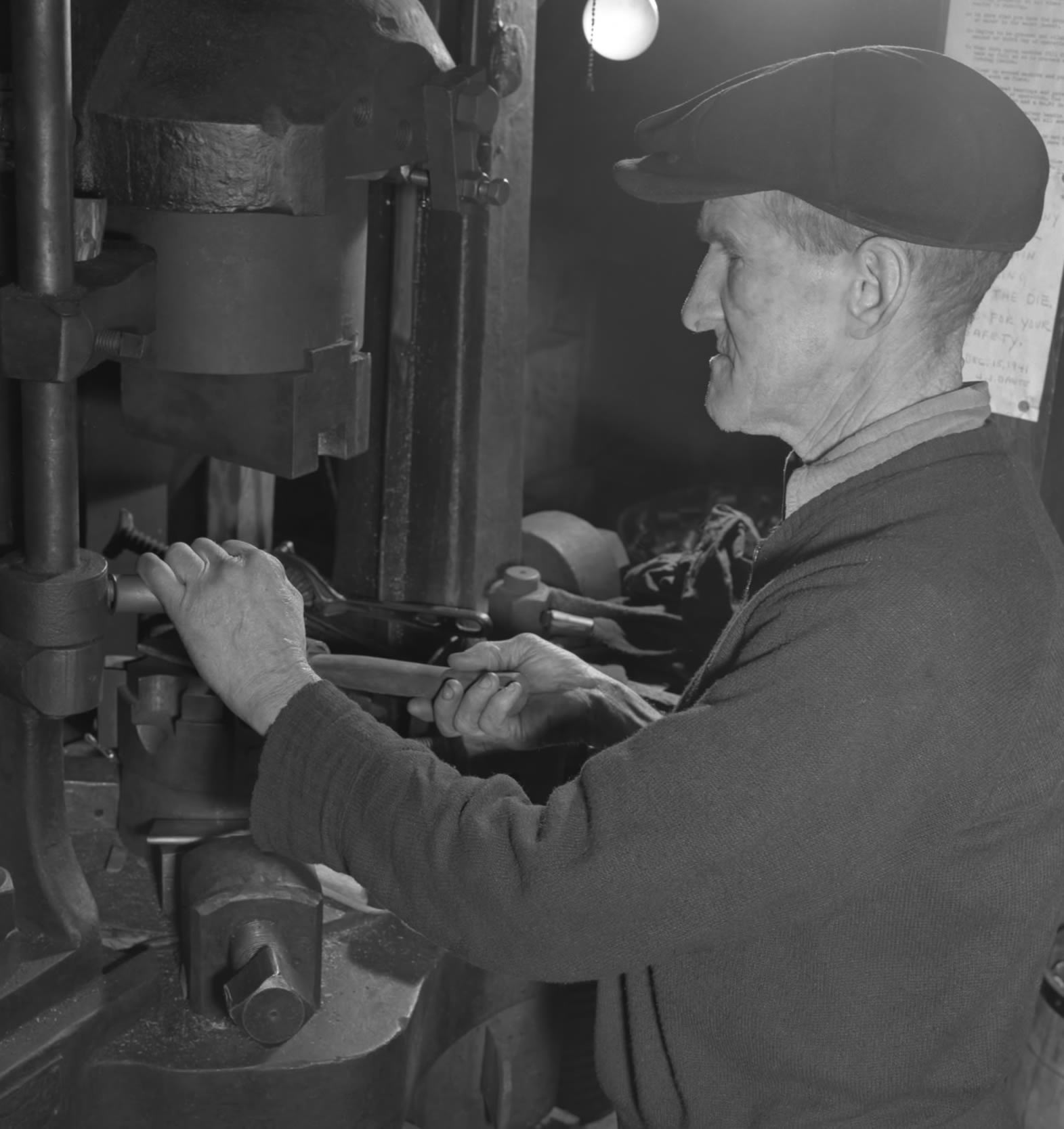 Guy working on a drill press